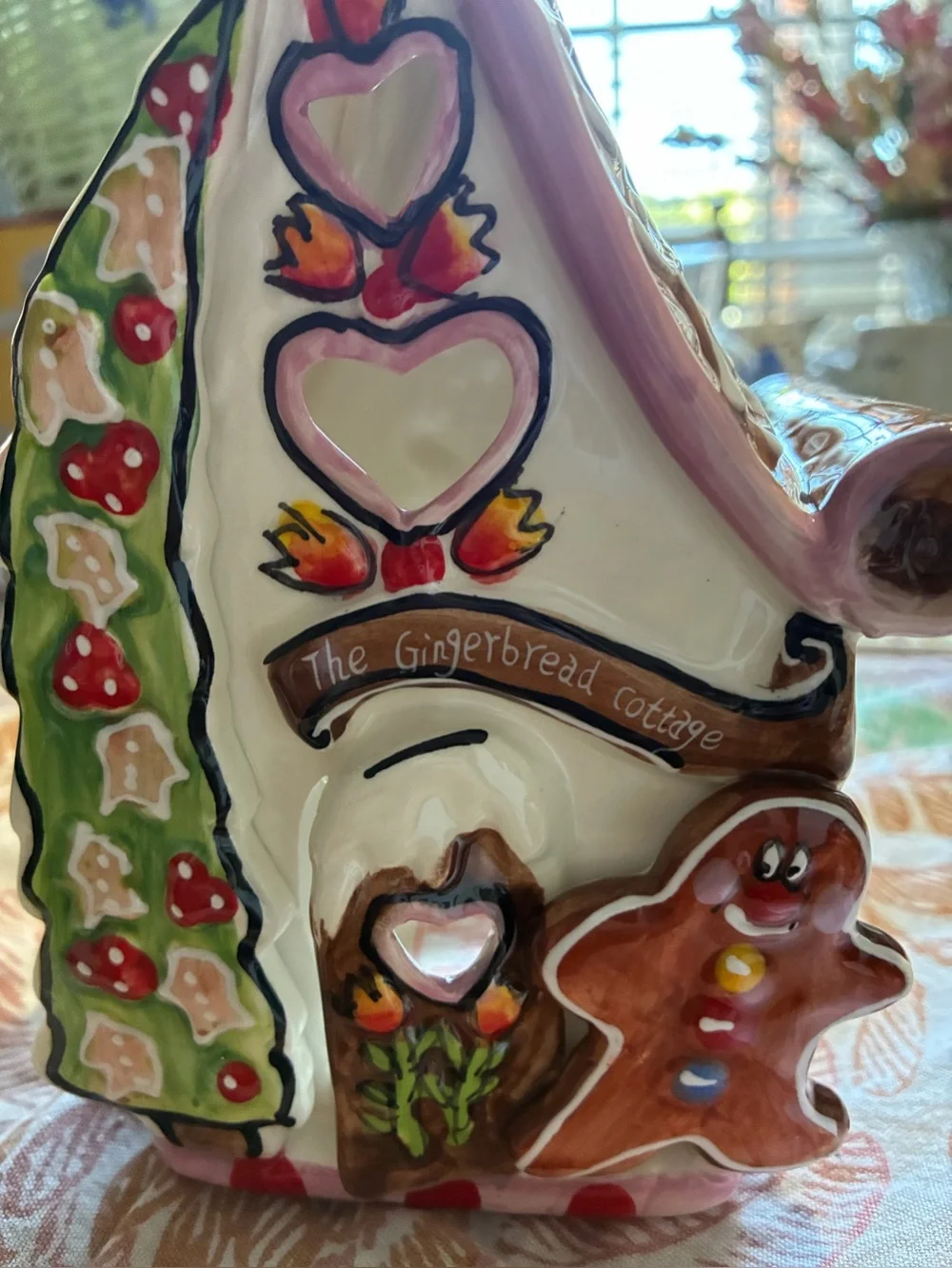 Blue Sky “The Gingerbread Cottage”. In new condition. Pink, brown, red & green.